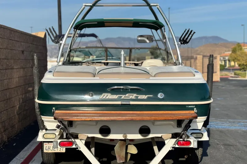 Slide: The Image of 2002 MasterCraft MariStar 230 VRS boat on trailer, rear view, parked outdoors. - 4