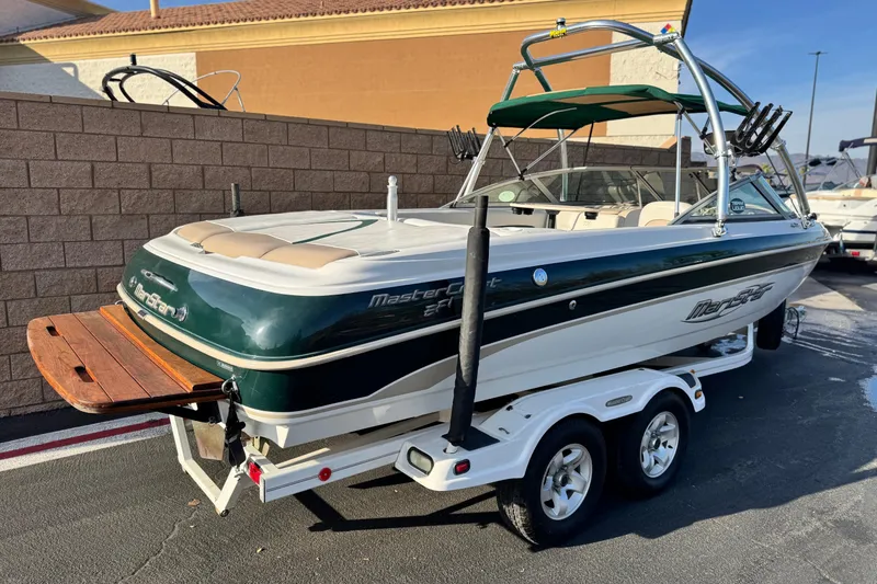 Slide: The Image of 2002 MasterCraft MariStar 230 VRS boat on trailer, parked outdoors. - 5