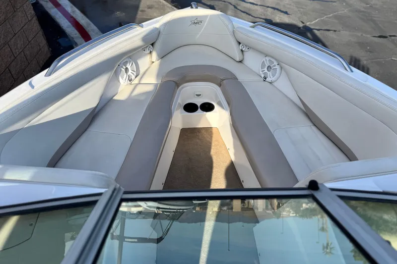 Slide: The Image of 2002 MasterCraft MariStar 230 VRS boat interior with beige seating and built-in speakers. - 8