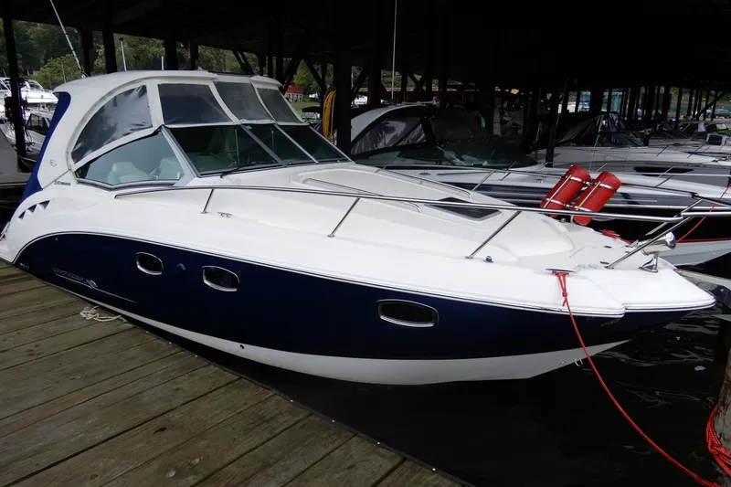 The Image of 2016 Chaparral 310 Signature boat docked, featuring sleek design and modern amenities. - 0