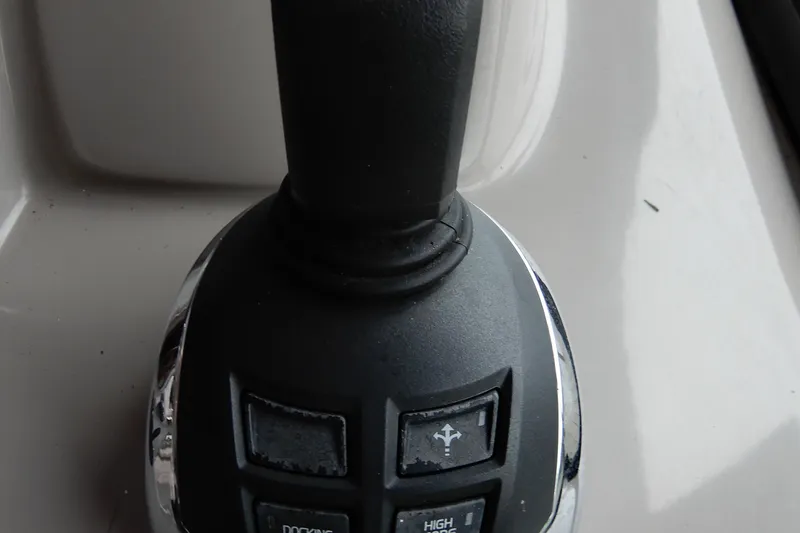 Slide: The Image of Close-up of 2016 Chaparral 310 Signature boat throttle control. - 25