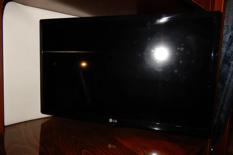 Slide: The Image of LG TV inside 2016 Chaparral 310 Signature boat cabin. - 34