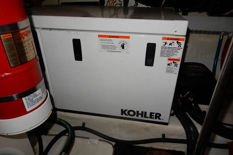Slide: The Image of Kohler generator in 2016 Chaparral 310 Signature boat engine room. - 49