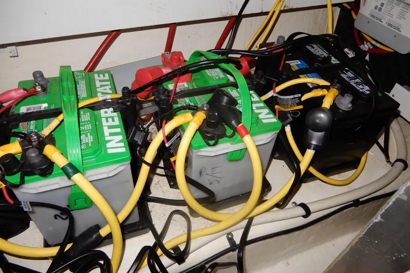 Slide: The Image of Batteries and wiring in 2016 Chaparral 310 Signature boat engine compartment. - 50