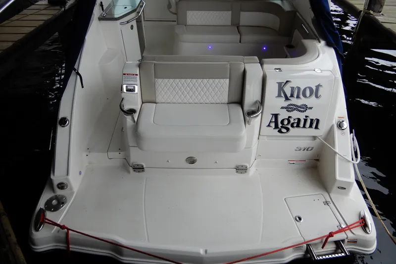 Slide: The Image of 2016 Chaparral 310 Signature boat with "Knot Again" name on the stern. - 8