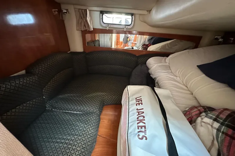 Slide: The Image of Interior cabin of 2006 Four Winns 318 Vista with seating and life jackets. - 6