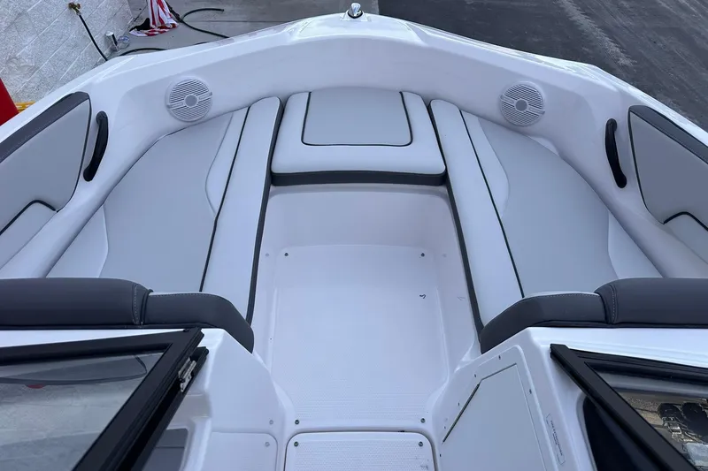 Slide: The Image of 2025 Yamaha Boats SX190 interior with sleek seating and modern design. - 12