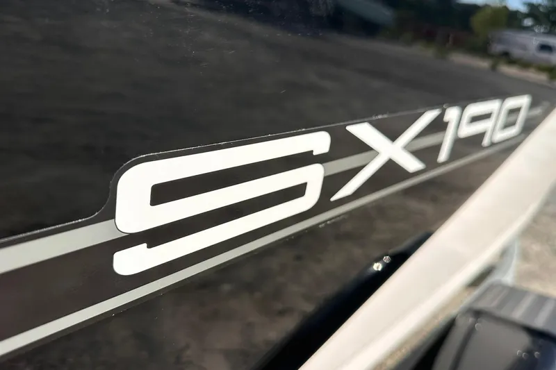 Slide: The Image of 2025 Yamaha Boats SX190 logo on sleek black surface. - 2