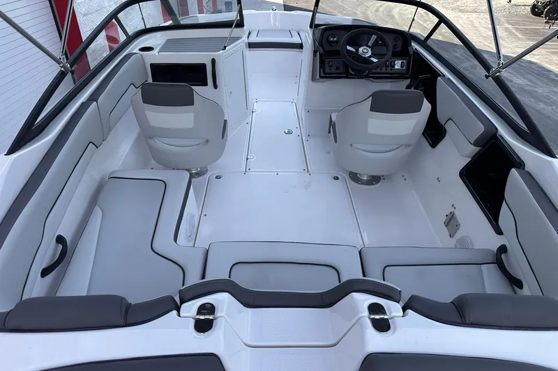 Slide: The Image of 2025 Yamaha Boats SX190 interior with modern seating and steering console. - 4