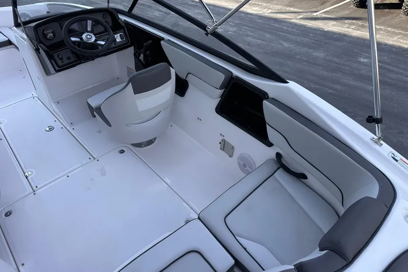 Slide: The Image of 2025 Yamaha Boats SX190 interior with sleek seating and modern dashboard design. - 6