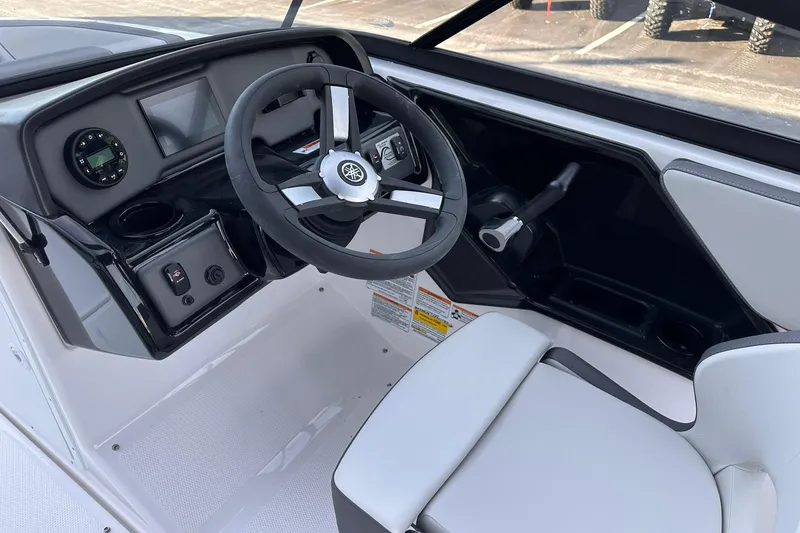 Slide: The Image of 2025 Yamaha Boats SX190 cockpit with steering wheel and control panel. - 8