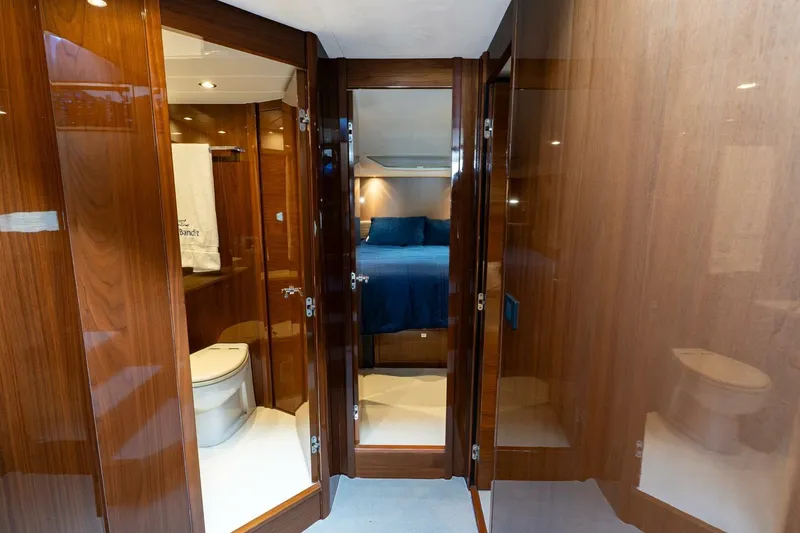 Slide: The Image of Luxurious interior of 2015 Princess 56 Flybridge Motor Yacht with wood finish and cozy bedroom. - 10