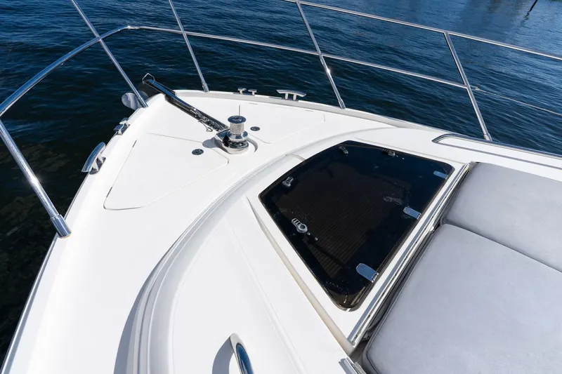 Slide: The Image of Bow of 2015 Princess 56 Flybridge Motor Yacht with sunpad and hatch. - 19