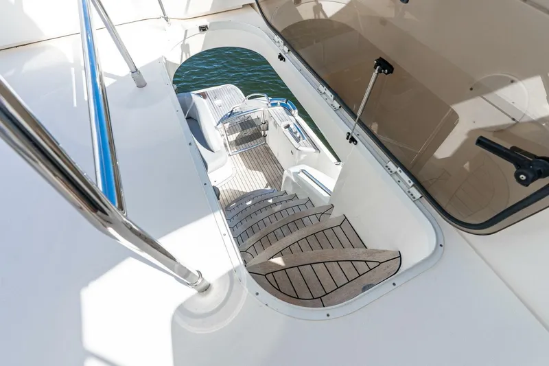 Slide: The Image of Staircase on 2015 Princess 56 Flybridge Motor Yacht leading to lower deck. - 28