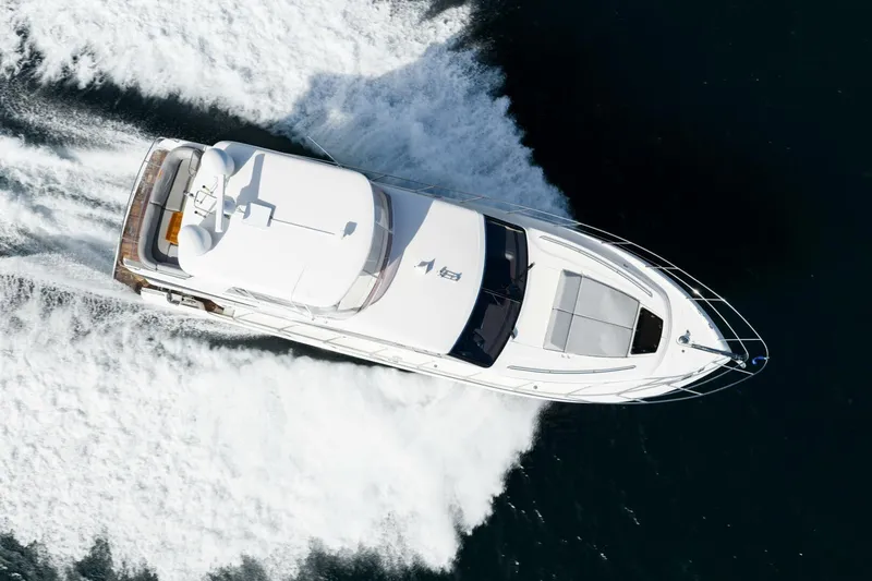 Slide: The Image of Aerial view of 2015 Princess 56 Flybridge Motor Yacht cruising on water. - 4