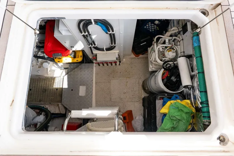 Slide: The Image of Engine room of 2015 Princess 56 Flybridge Motor Yacht, showing equipment and storage. - 48