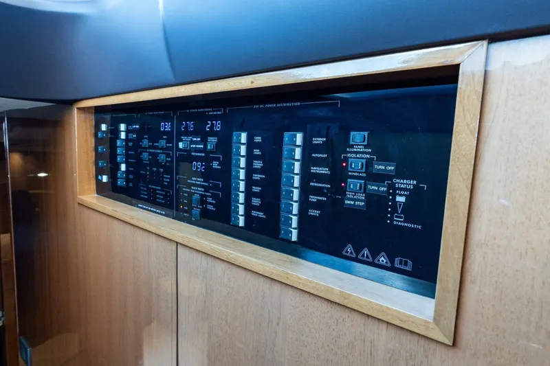 Slide: The Image of Control panel of 2015 Princess 56 Flybridge Motor Yacht, featuring various switches and indicators. - 9