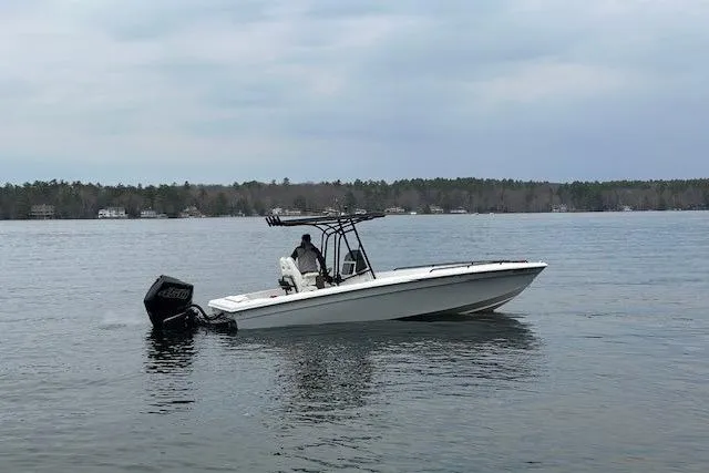 The Image of 2004 Concept 27 boat on calm lake with overcast sky. - 0
