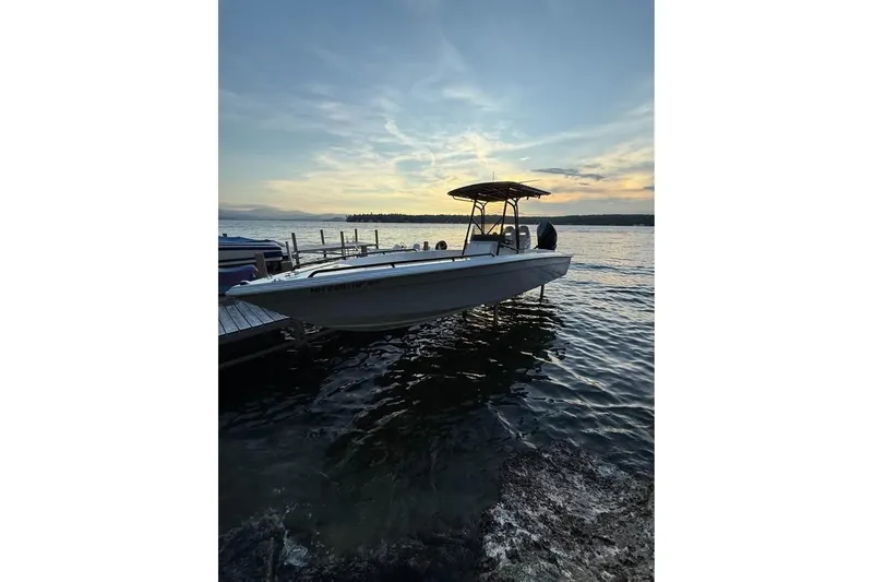 Slide: The Image of Boat docked at sunset, Concept 27 model, 2004, on calm water. - 10