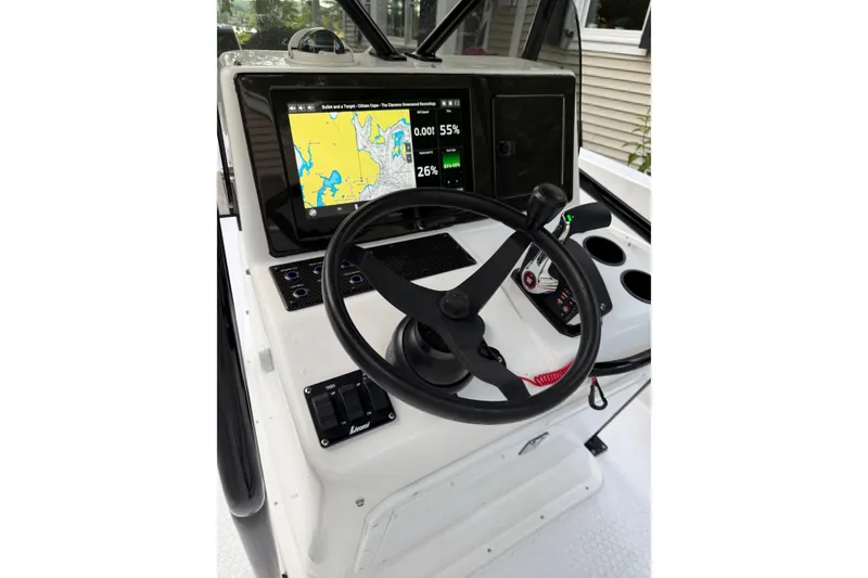 Slide: The Image of Boat cockpit with steering wheel, navigation screen, and controls, Concept 27, 2004 model. - 12