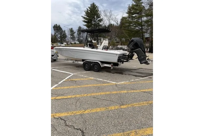 Slide: The Image of Boat on trailer in parking lot, Concept 27 model, 2004, with outboard motor. - 4