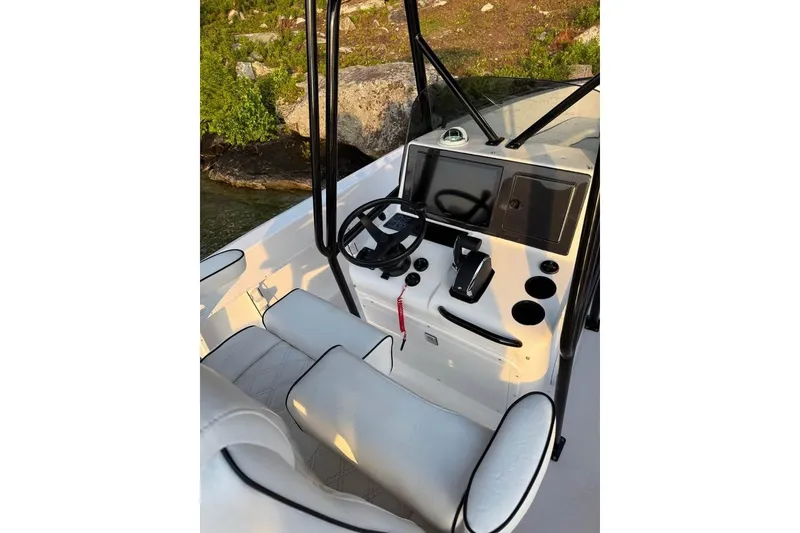 Slide: The Image of Boat cockpit with steering wheel, controls, and seating; Concept 27, 2004 model. - 5