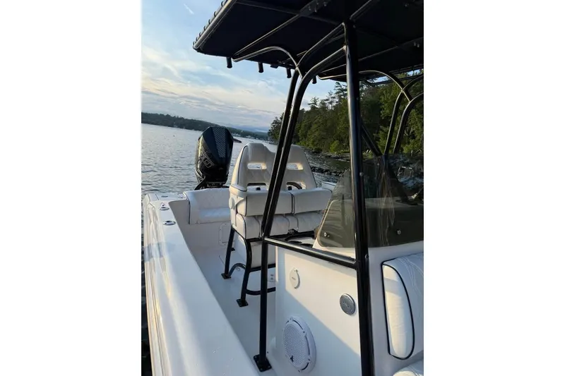 Slide: The Image of Boat interior with seating and controls, Concept 27 model, 2004, on a serene lake. - 6