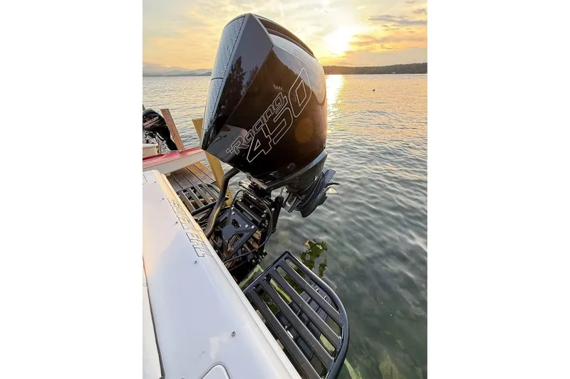 Slide: The Image of Boat with powerful outboard motor on lake at sunset, Concept 27, 2004 model. - 8