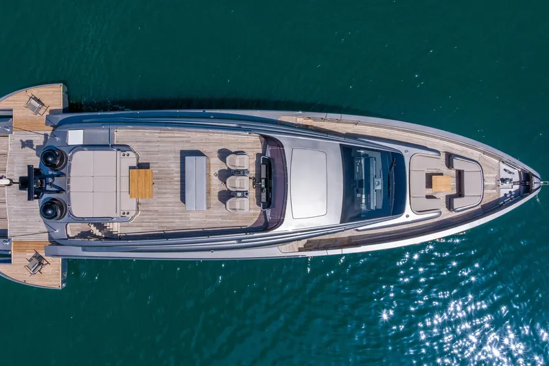Slide: The Image of Aerial view of 2025 Pershing GTX 80 yacht on sparkling blue water. - 13