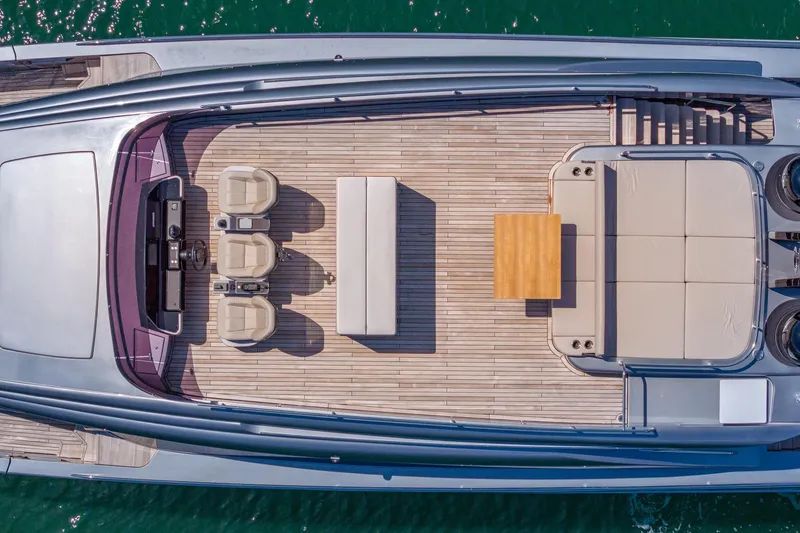 Slide: The Image of Aerial view of 2025 Pershing GTX 80 yacht deck with seating and table arrangement. - 14