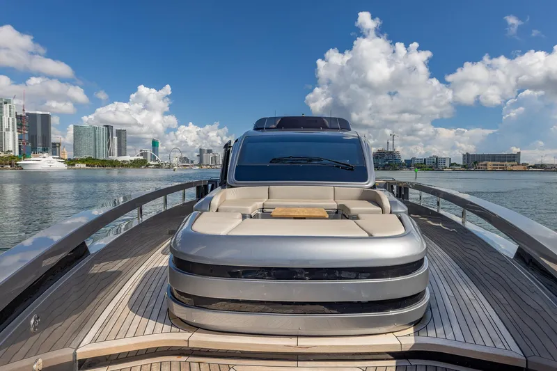 Slide: The Image of Luxury Pershing GTX 80 yacht, 2025 model, docked with city skyline in background. - 20