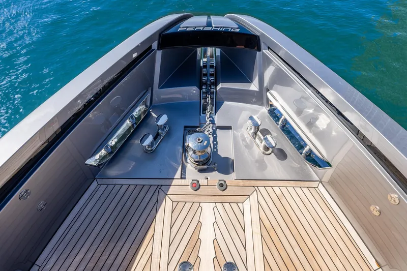 Slide: The Image of Bow view of 2025 Pershing GTX 80 yacht with sleek deck design and anchor system. - 22