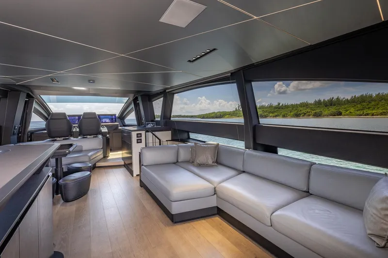 Slide: The Image of Luxurious interior of 2025 Pershing GTX 80 yacht with modern seating and panoramic windows. - 30