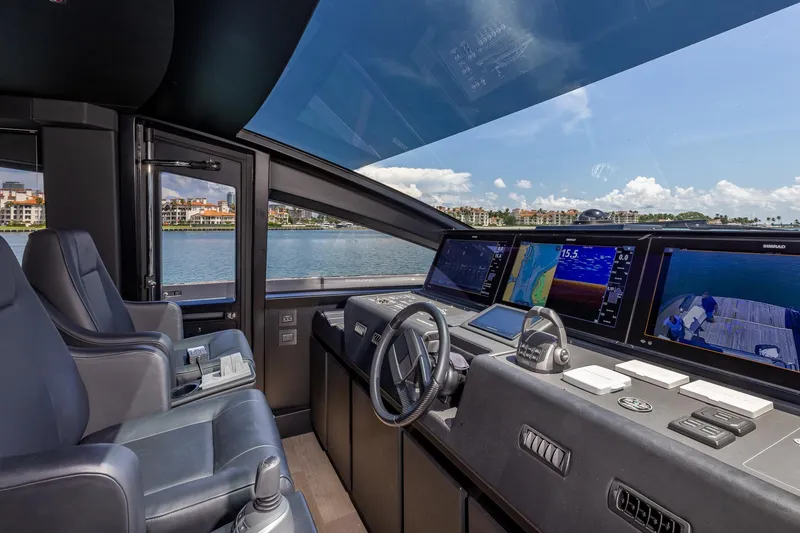 Slide: The Image of Interior cockpit of 2025 Pershing GTX 80 yacht with advanced navigation displays. - 34