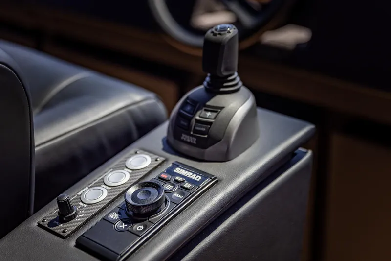 Slide: The Image of Control panel of 2025 Pershing GTX 80 yacht with joystick and buttons. - 36