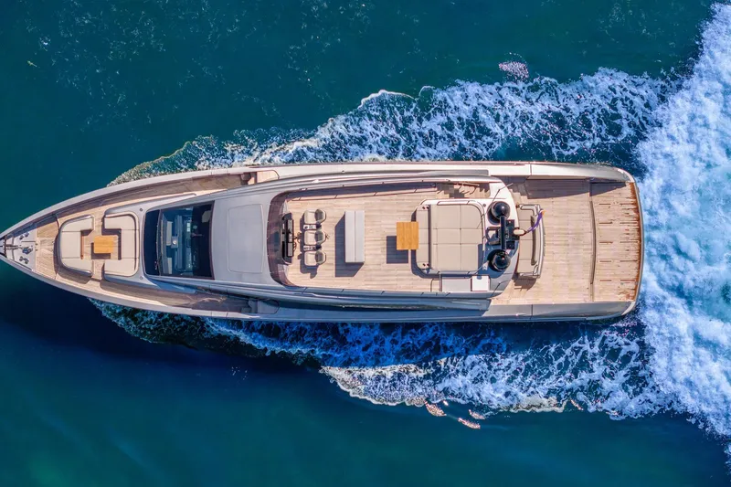 Slide: The Image of Aerial view of 2025 Pershing GTX 80 yacht cruising on blue ocean waters. - 4