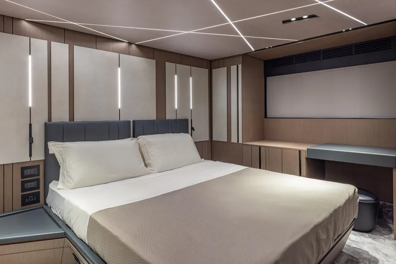 Slide: The Image of Luxurious bedroom interior of 2025 Pershing GTX 80 yacht with modern design and ambient lighting. - 41