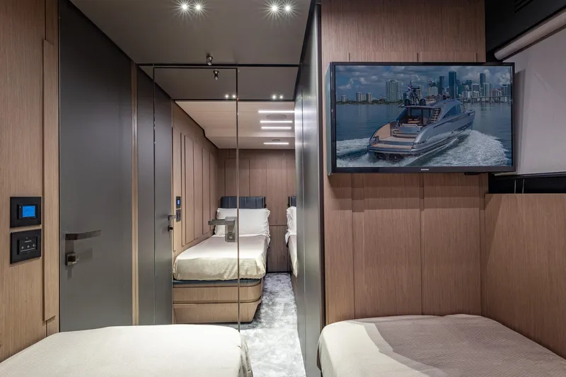 Slide: The Image of Luxurious interior of 2025 Pershing GTX 80 yacht with modern design and TV display. - 42
