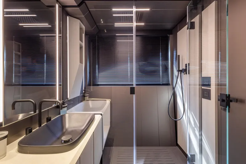 Slide: The Image of Modern bathroom interior of 2025 Pershing GTX 80 yacht with sleek design and glass shower. - 45