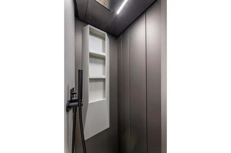 Slide: The Image of Modern shower interior on Pershing GTX 80 yacht, featuring sleek design and shelving, 2025 model. - 50