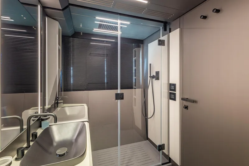 Slide: The Image of Modern bathroom interior on Pershing GTX 80 yacht, featuring sleek design and glass shower. - 51