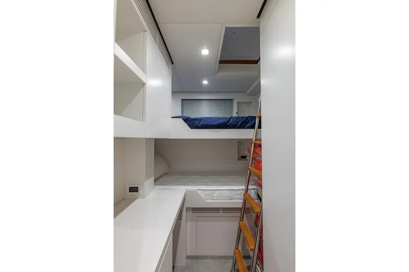 Slide: The Image of Interior of 2025 Pershing GTX 80 yacht with modern bunk beds and sleek design. - 52