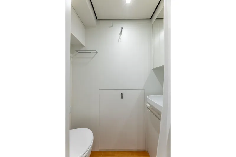 Slide: The Image of Compact bathroom interior in 2025 Pershing GTX 80 yacht, featuring modern fixtures and minimalist design. - 53