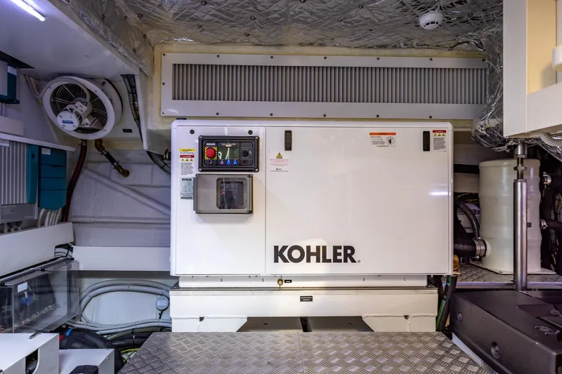 Slide: The Image of Engine room of 2025 Pershing GTX 80 yacht featuring Kohler generator. - 56