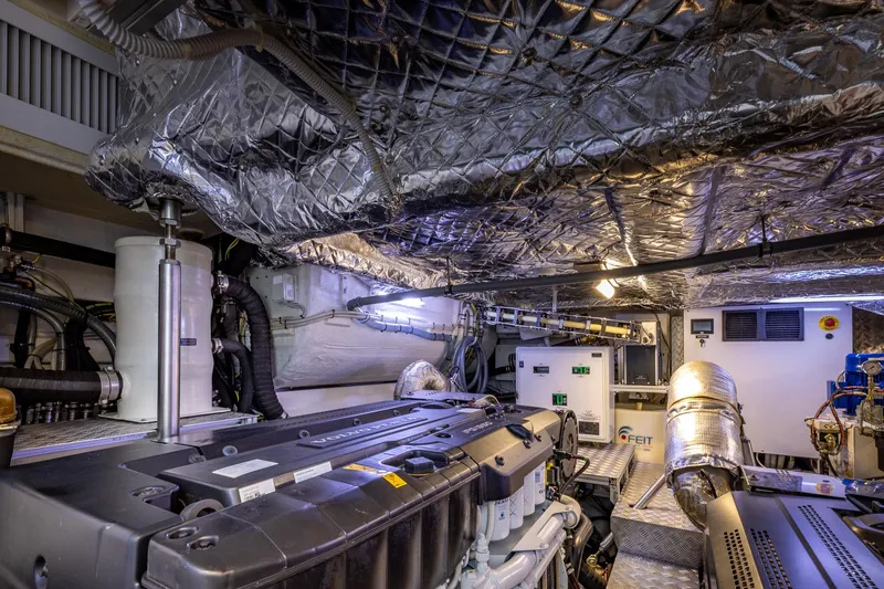 Slide: The Image of Engine room of 2025 Pershing GTX 80 yacht, showcasing advanced machinery and insulation. - 58