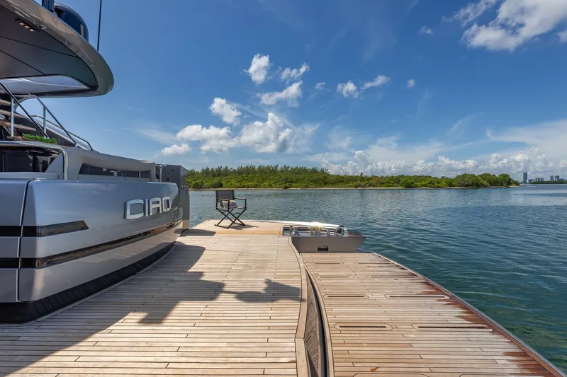 Slide: The Image of Luxury Pershing GTX 80 yacht docked by serene waters, 2025 model. - 8