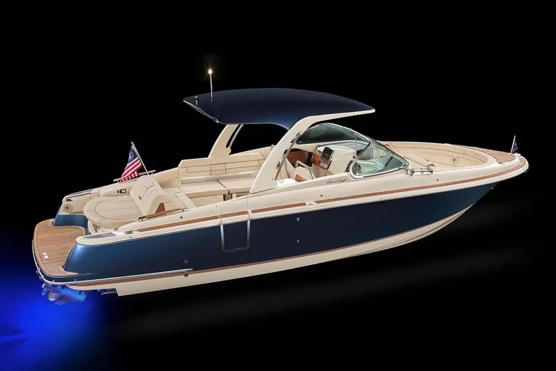 Slide: The Image of 2025 Chris-Craft Launch 31 GT boat with sleek design, navy hull, and elegant interior. - 4