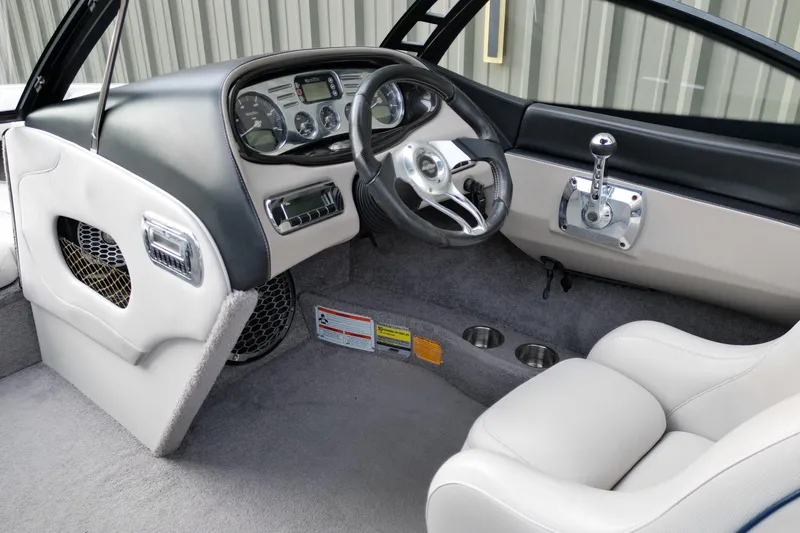 Slide: The Image of 2009 Malibu Wakesetter VTX interior with steering wheel, dashboard, and seating. - 12