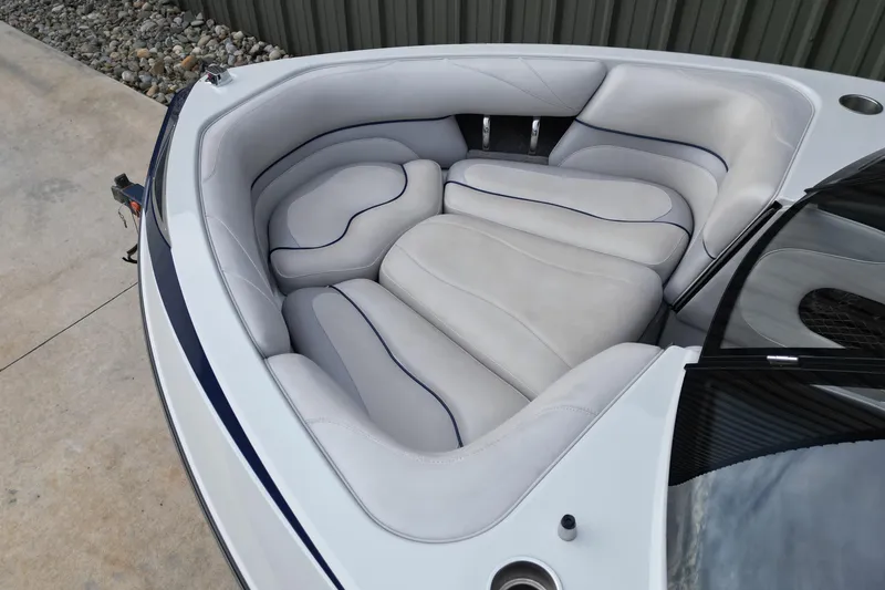 Slide: The Image of 2009 Malibu Wakesetter VTX boat interior with plush seating and sleek design. - 4