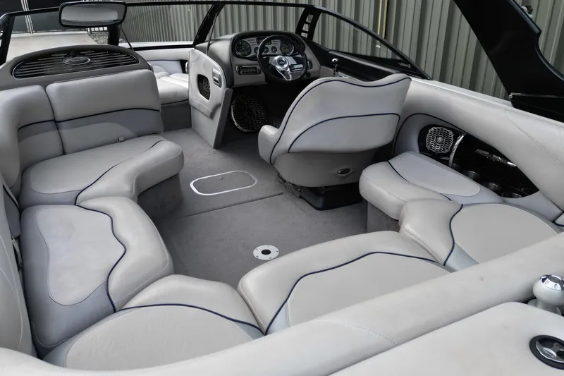 Slide: The Image of 2009 Malibu Wakesetter VTX interior with gray seating and modern dashboard design. - 7